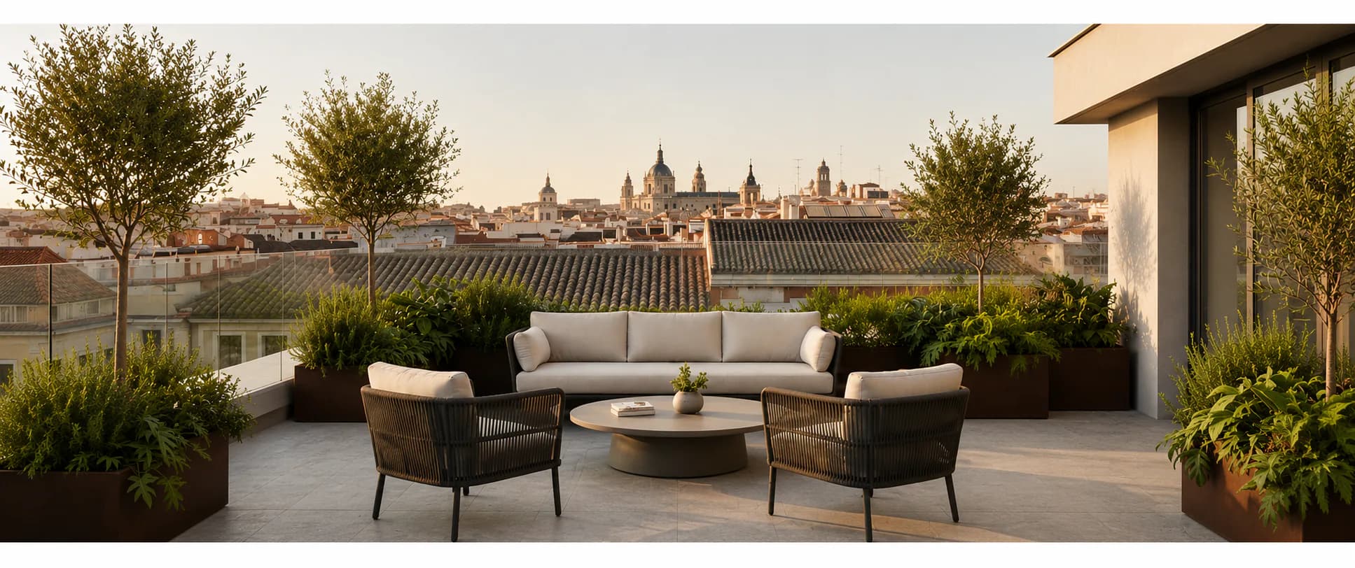 Residential terrace overlooking Madrid in warm evening light.