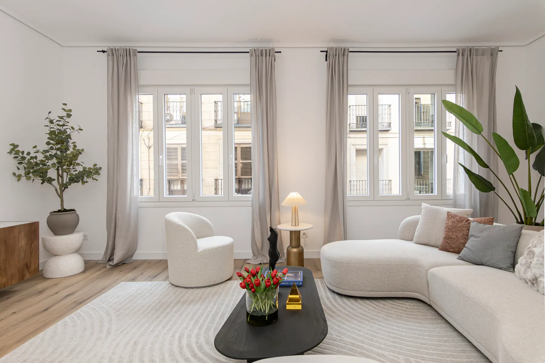 Living room view in the Huertas 53 residential rehabilitation.